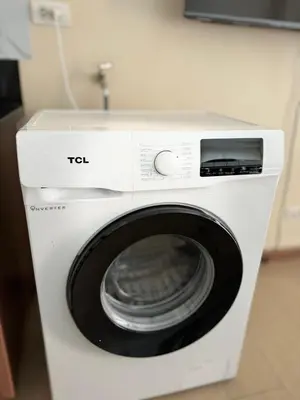 a white washing machine sitting in a room at COZI Venice Luxury Residences Alessandro BGC w Pool Gym in Manila