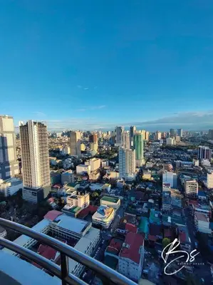a view of a city with buildings in the background at Birch Tower by Bright Space Manila in Manila