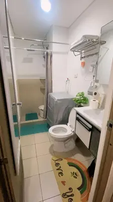 a bathroom with a toilet and a sink at Anne's Place at Hope Residences - SMDC Condo Beside SM Trece in Trece Martires