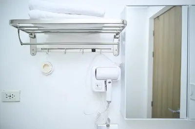 a bathroom with a mirror and a towel rack at Anne's Place at Hope Residences - SMDC Condo Beside SM Trece in Trece Martires