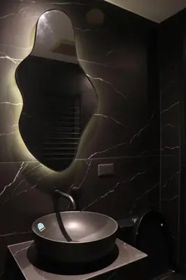 a bathroom with a sink and a mirror on the wall at Modern Nordic 1 Bedroom Condo near Eastwood, Quezon City in Manila