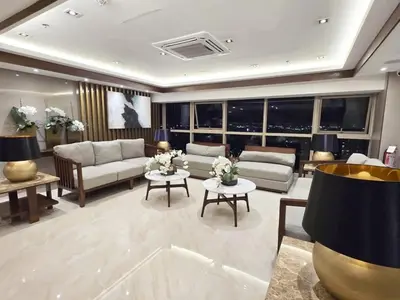 a living room with couches and tables and windows at Cozy Easy Escape in Manila