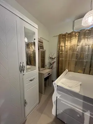 a white bathroom with a sink and a mirror at SMDC Good Stays Shore 2 - Unit 1289 Tower 2 in Manila