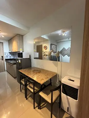 a kitchen and dining room with a table and chairs at SMDC Good Stays Shore 2 - Unit 1289 Tower 2 in Manila