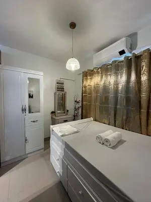a bathroom with a bed with two towels on it at SMDC Good Stays Shore 2 - Unit 1289 Tower 2 in Manila