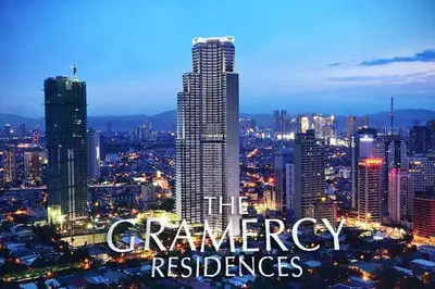 a city skyline at night with the words theenery reserves at The Gramercy Residences Unit for Rent in Manila