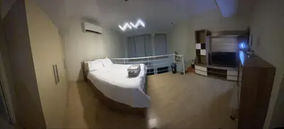 a hospital room with a bed and a tv at The Gramercy Residences Unit for Rent in Manila