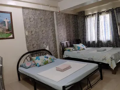 a room with two beds in a room at Kassel DORZ Hostel Bldg 16 Condostaycation in Manila