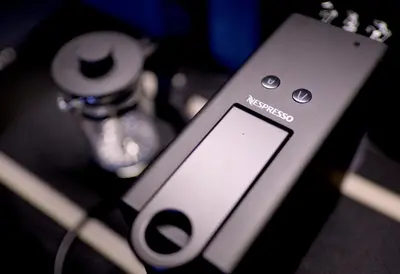 a close up of a cell phone sitting on a table at Luxury Apartment with PA, Skyline View & Top Amenities in Manila