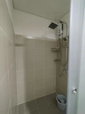 a bathroom with a shower with a toilet at 2br Condo Coast Residence near MOA NAIA Ayala WTC in Manila