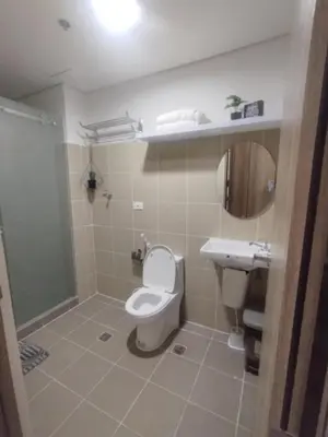 a bathroom with a toilet and a sink at 2br Condo Coast Residence near MOA NAIA Ayala WTC in Manila