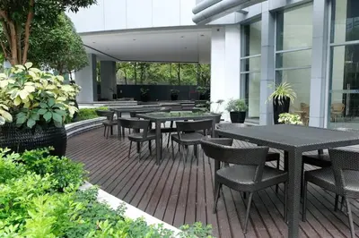 a group of tables and chairs on a patio at Marina- Avant BGC parking w fee in Manila