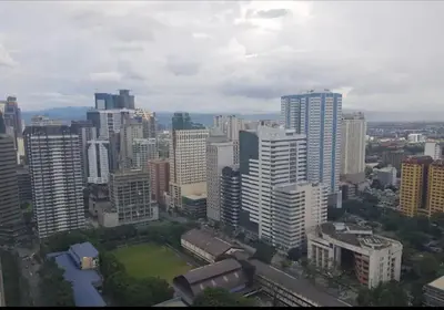 an aerial view of a city with tall buildings at Twin Oaks Place West Tower in Manila