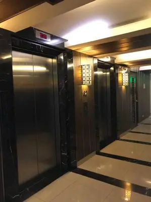a hallway of a elevator in a building at Twin Oaks Place West Tower in Manila