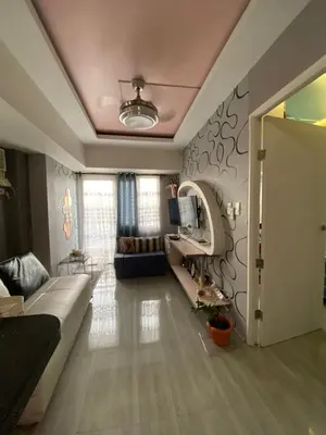 a living room with a couch and a table at Casa Maria in Manila
