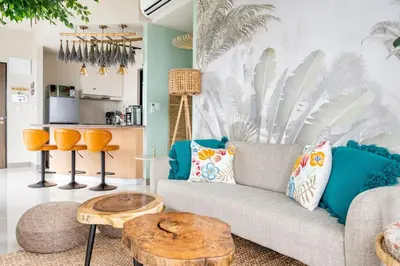 a living room with a couch and a table at Tree of Life Penthouse 3BR w Gym Pool Sauna More in Manila