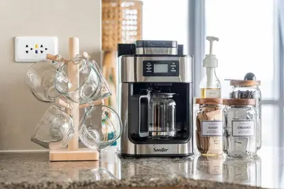 a kitchen counter with a coffeemaker and a coffee maker at Tree of Life Penthouse 3BR w Gym Pool Sauna More in Manila