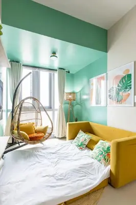 a room with a couch and a swing at Urban Oasis Serenity in the City w Pool Gym More in Manila