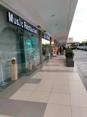 an empty mall with a music and retail store at Comfy 19 shore2 Residence Free parking, Near Airport, IKEA, MOA, Pasay City in Manila