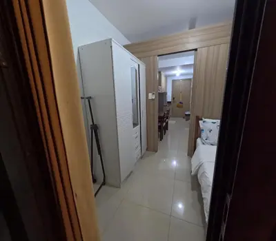 a room with a white cabinet and a couch at Comfy 22 shore2 Residence Free parking, Near Airport, IKEA, MOA, Pasay City in Manila