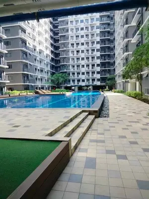 a swimming pool in the middle of a building at Comfy 42 shore 3 Residence Free parking, Near Airport, IKEA, MOA, Pasay City in Manila