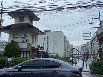 a car parked in front of a building on a street at Hungary109 Service Apartments Near Airport at Kassel Residences in Manila
