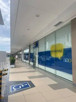 an empty hallway of a building with a sign on it at Shore Residences Tower D - One Bedroom I Good for 6 guests I Walk to Mall of Asia in Manila