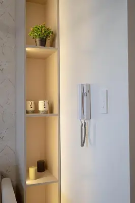 a white refrigerator with a phone on the door at Modern Living 1 Makati in Manila