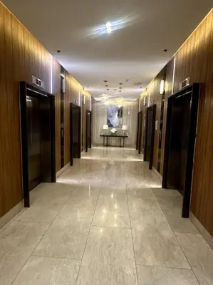 a hallway in a building with a painting on the wall at Ellie's Place Shore 3 T3 in Manila