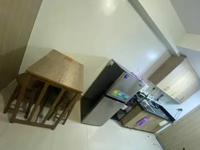 an overhead view of a kitchen with a stove and stool at Shore2 Condo 1BR Balcony, Wifi, Pool, MOA, Airport in Manila