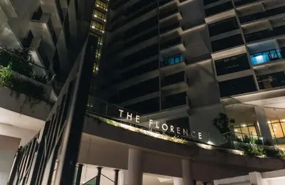 a building with the hynes sign on it at BGC McKinley Taguig 1BR with Balcony near Venice Grand Canal mall in Manila