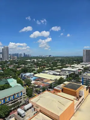 an aerial view of a city with buildings at Cozy apartment near Greenbelt Makati City in Manila