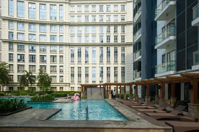 a pool in the middle of a building at Ocuna Suite - NAIA Manila Airport in Manila