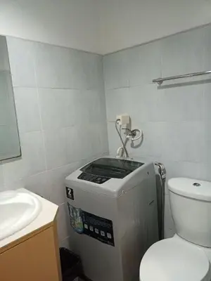 a small bathroom with a toilet and a sink at Sea Residences Staycation Near Moa Pasay by Jhay in Manila