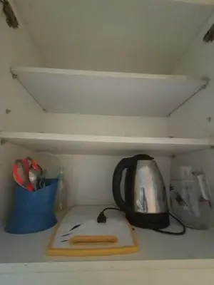 a tea kettle sitting on top of a shelf at Sea Residences Staycation Near Moa Pasay by Jhay in Manila