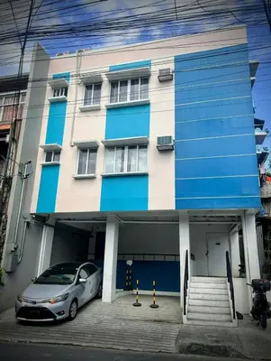 a car parked in front of a building at Origin Studios - Walk to Highstreet, BGC in Manila