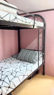 a bunk bed in a room with a bunk bed frame at USO House in Manggahan