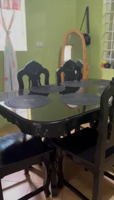 a dining room table with four chairs around it at USO House in Manggahan
