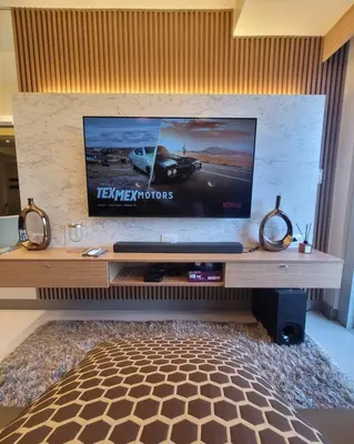 a living room with a flat screen tv on a wall at Uptown Parksuites Tower 2 BGC - Staycations Up Above 9 in Manila