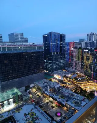 an aerial view of a city at night at Uptown Parksuites Tower 2 BGC - Staycations Up Above 9 in Manila