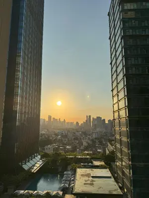 a view of the city from a skyscraper at One Uptown Residences at BGC - Staycations Up Above 15 in Manila