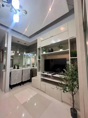 a living room with a kitchen and a dining room at Sea Residences by Richnells in Manila