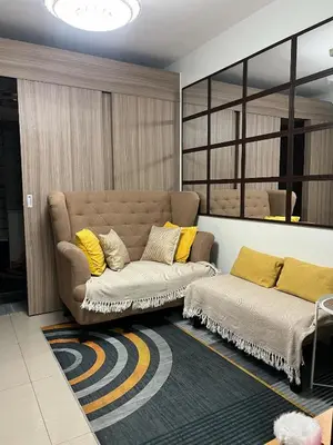 a living room with a couch and a rug at Nordic Style - 2BR Shore 2 Residences Tower 2 in Manila