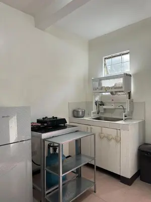 a small kitchen with a sink and a counter at 2 StoryHome in Tanza near SM along Main Road in Tanza
