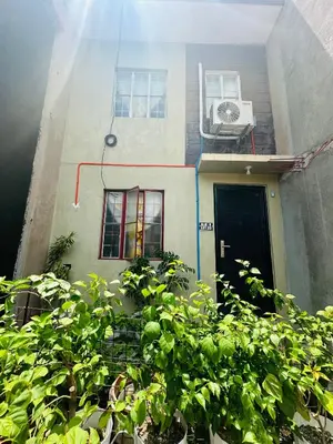 a building with a window and a air conditioner at 2 StoryHome in Tanza near SM along Main Road in Tanza