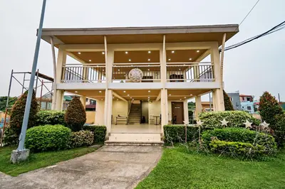 a large house with a porch and a balcony at Precious Florannjoe in Manila