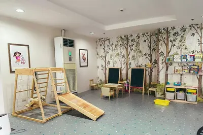 a room with a classroom with furniture and wallpaper at Condo unit in Manda near Edsa, Shangrila, Megamall in Manila