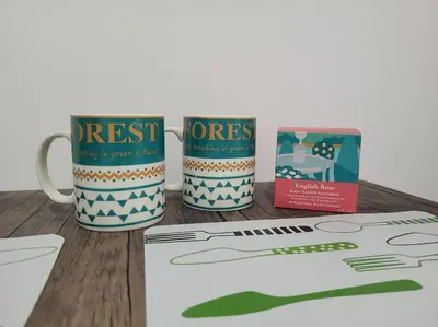 a couple of coffee mugs sitting on a table at Jireh's Staycation in Makati in Manila