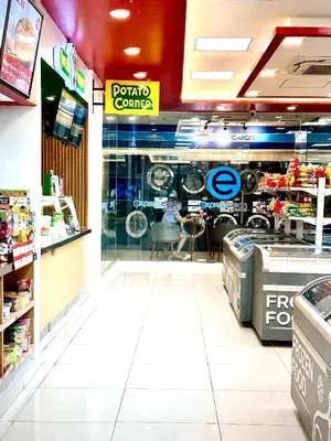 a grocery store with a display window in a store at High Rise Condo with Balcony, Pool, Grand Lobby, and Sky Garden 22F in Manila