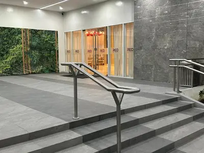 a set of stairs in front of a building at High Rise Condo with Balcony, Pool, Grand Lobby, and Sky Garden 22F in Manila